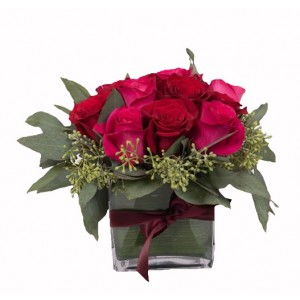 12 red and pink roses in a square vase