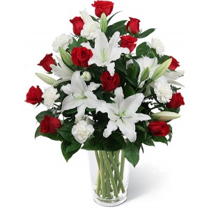 red roses with casa blanca in a vase